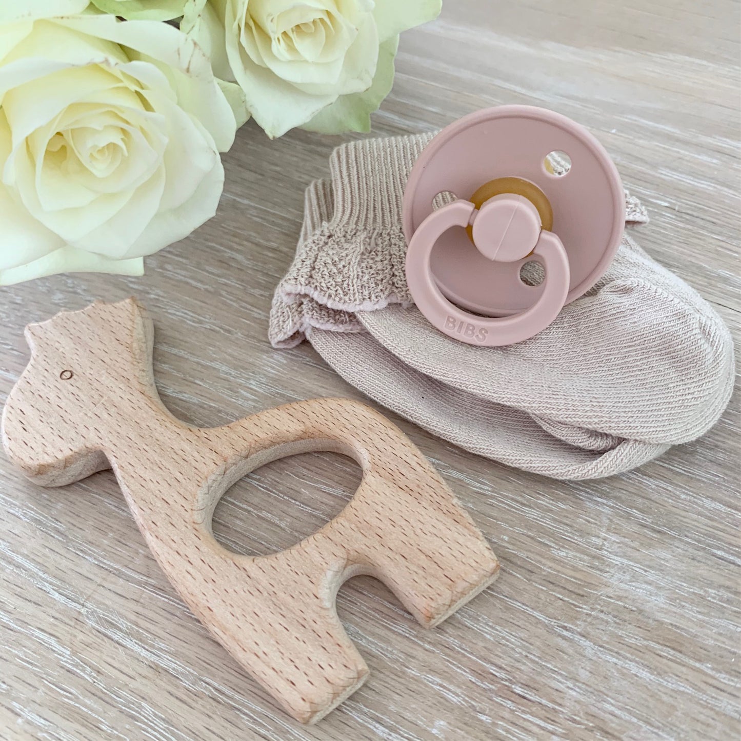 Wooden toy and blush dummy